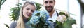 Man and Woman Florist Holding Hortensia Flower