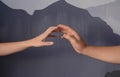 Man and woman giving each other hands on grey background. Concept of support and help Royalty Free Stock Photo