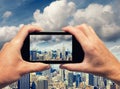 Man and woman hand capturing New York City skyline with smartpho Royalty Free Stock Photo