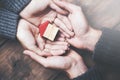 Man and woman hands on  house model Royalty Free Stock Photo