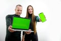 man and woman in hands with laptop and phone green screen chroma key space for text on white background cheerful happy Royalty Free Stock Photo