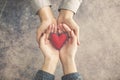 Man and woman hands together with red heart Royalty Free Stock Photo