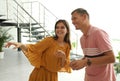 Man and woman having conversation in hall Royalty Free Stock Photo