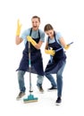 Man and woman having fun with cleaning supplies on white background Royalty Free Stock Photo