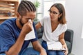 Man and woman having psychology session consueling patient at psychology clinic Royalty Free Stock Photo