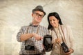 Man and woman hold retro camera. Texture background Royalty Free Stock Photo