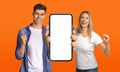 Man And Woman Holding Big Blank Smartphone And Celebrating Success Royalty Free Stock Photo