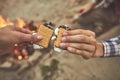 Man and woman holding biscuits to have quick meal