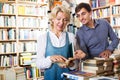 Man and woman holding books