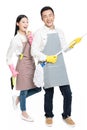 Man and woman holding cleaning supplies
