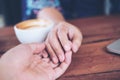 A man and a woman holding each other hands with feeling love Royalty Free Stock Photo