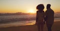 Man with woman holding hands, beach at sunset and sea with back view, mockup space and travel with couple outdoor. Love Royalty Free Stock Photo