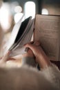 Man and a woman are holding hands and reading books. Royalty Free Stock Photo