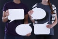 Man and woman holding speech bubbles Royalty Free Stock Photo