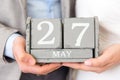 Man and Woman Holding 27th of May Wedding Anniversary Date