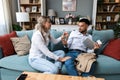 Man and woman home finances argue with credit card and digital tablet, online shopping and spending money. Relationship Royalty Free Stock Photo