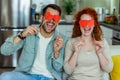 Couple at home holding red heart valentine in hands Royalty Free Stock Photo