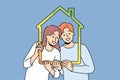 Man and woman with house outline symbolizing family property and energy efficient housing