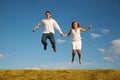 Man and woman jumping Royalty Free Stock Photo