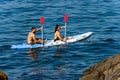 Man and woman kayak in the blue sea - Liguria Italy Royalty Free Stock Photo