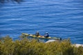 Man and woman in kayak near to shore on sunny day at Lake Tahoe Royalty Free Stock Photo