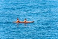 A Man and a Woman Kayaking in the Blue Sea - Liguria Italy Royalty Free Stock Photo