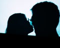 Man and woman kissing projector shadows Royalty Free Stock Photo