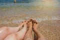 man and woman legs on the beach Royalty Free Stock Photo