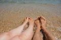 man and woman legs on the beach Royalty Free Stock Photo
