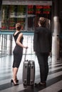 Man and woman looking for the flight cancellation information Royalty Free Stock Photo