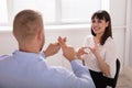 Man And Woman Making Sign Languages Royalty Free Stock Photo