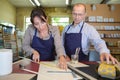 man and woman making wooden frame Royalty Free Stock Photo