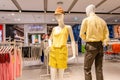 Man and woman mannequin wears yellow outfit