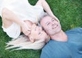 Man, woman and mature marriage on grass from above for relaxing break or day off weekend, travel or meadow. Happy couple Royalty Free Stock Photo