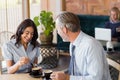 Man and woman meeting over coffee in restaurant Royalty Free Stock Photo