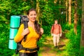 Man and woman in the morning in the woods