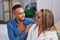 Man and woman mother and son hugging each other at bedroom Royalty Free Stock Photo