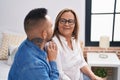 Man and woman mother and son hugging each other at bedroom Royalty Free Stock Photo