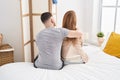 Man and woman mother and son hugging each other sitting on bed at bedroom Royalty Free Stock Photo