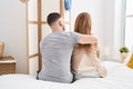 Man and woman mother and son hugging each other sitting on bed at bedroom Royalty Free Stock Photo