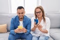 Man and woman mother and son using smartphone at home Royalty Free Stock Photo