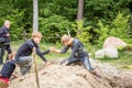 Man and woman in mud obstacle. Royalty Free Stock Photo