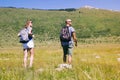 Man and woman in nature hiking in summer