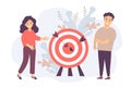 A man and a woman near a target with arrows in the center. Business concept - goal, teamwork, collaboration, result and success,