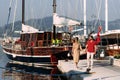 Man and woman near the yachts on the dock Royalty Free Stock Photo