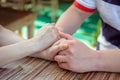 Man and woman, newlyweds holding hands with blurred background. Royalty Free Stock Photo