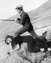 Man and woman next to a dry lake with fishing rod Royalty Free Stock Photo