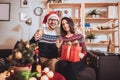 Man and woman opens Christmas gift at home Royalty Free Stock Photo