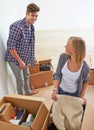 Man, woman and packing boxes for moving to new home or property investment, real estate or mortgage. Couple, happy and Royalty Free Stock Photo