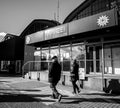 Man and woman passing by Police station Royalty Free Stock Photo